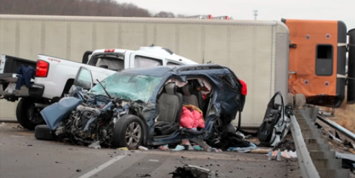 A car that has been smashed in to pieces.